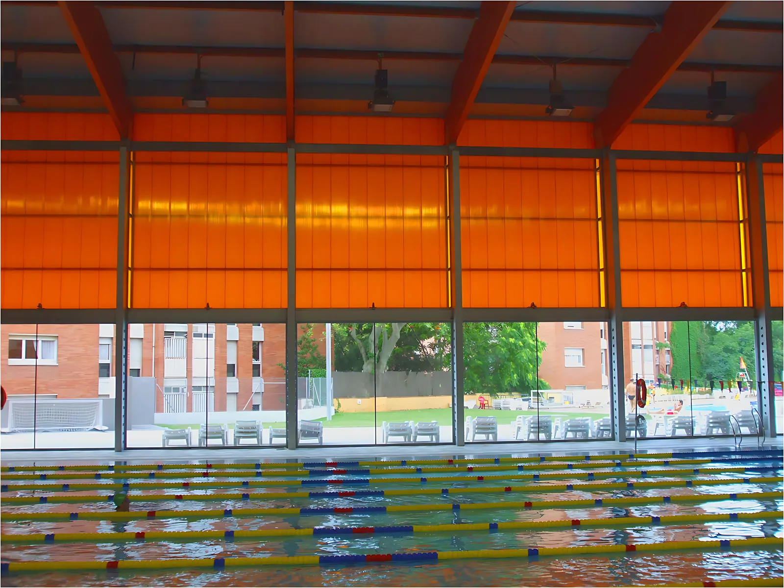 Swimming pool under translucent polycarbonate roof